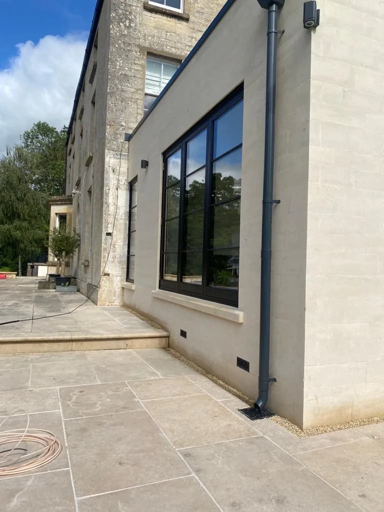 Side elevation of the contemporary stone extension meeting the original period stone building