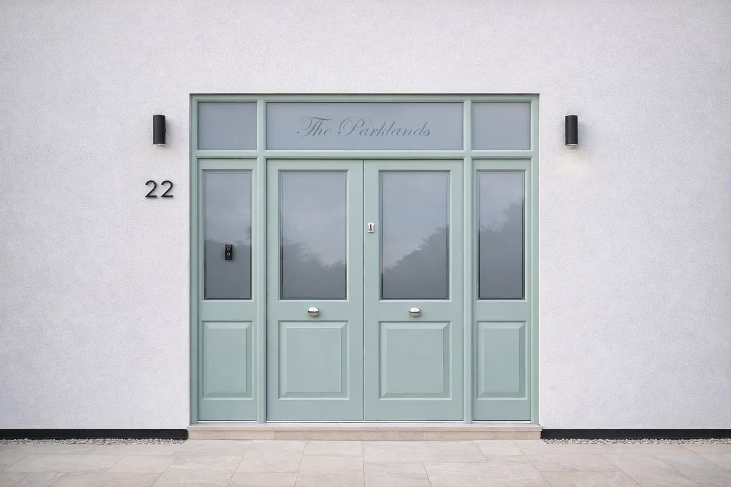 Sage-painted entrance doors with sidelights and a named toplight, seen across a rendered elevation