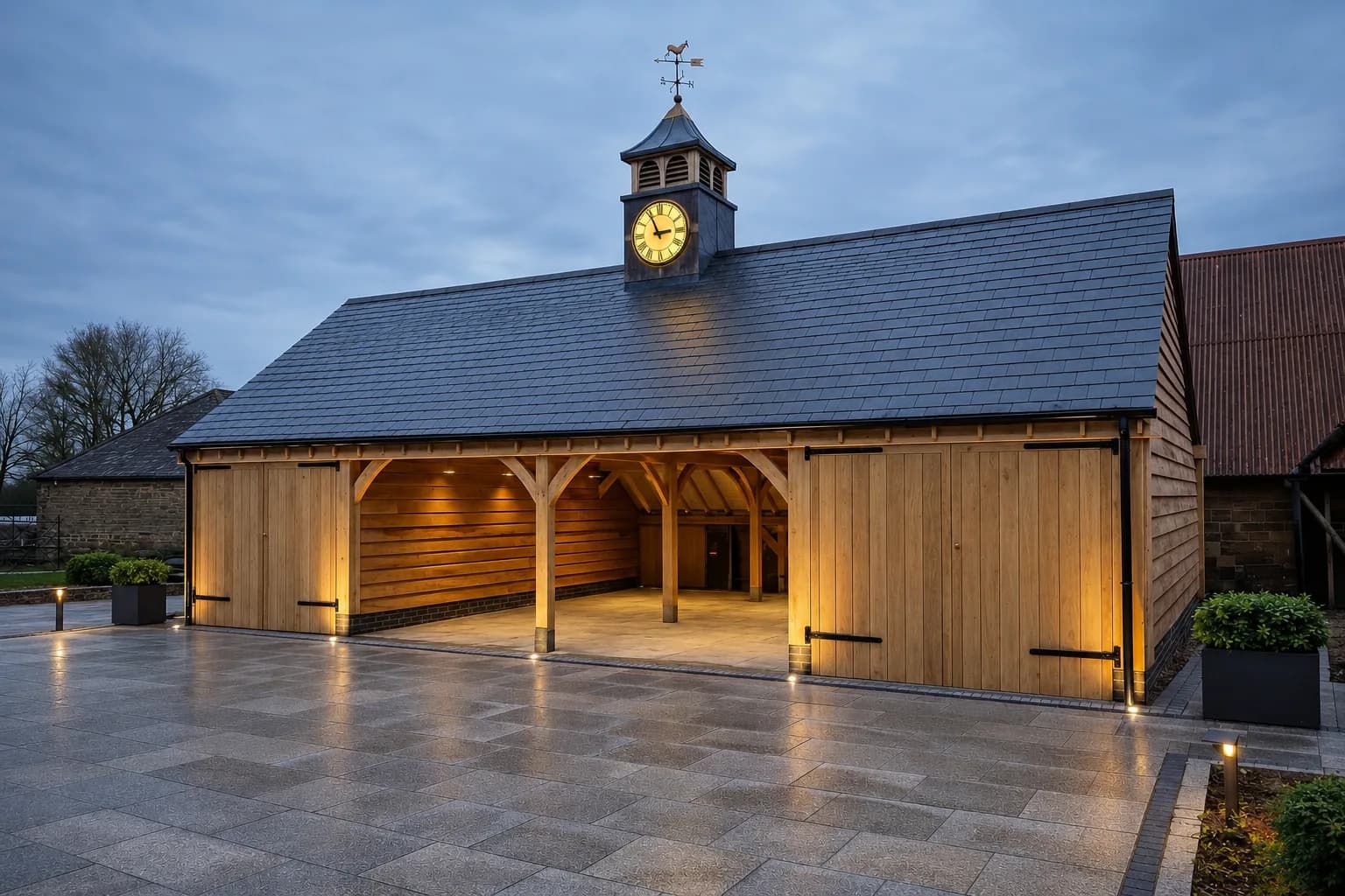 Multi-bay oak frame garage in a rural setting